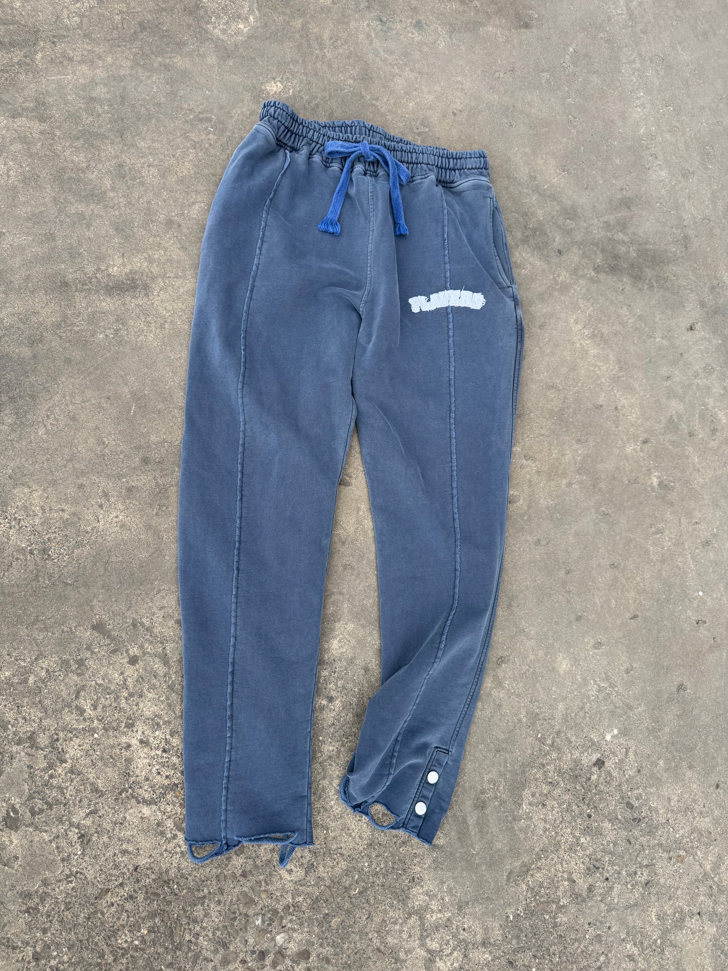 WASHED NAVY APPLIQUÉ DISTRESSED SWEATPANTS